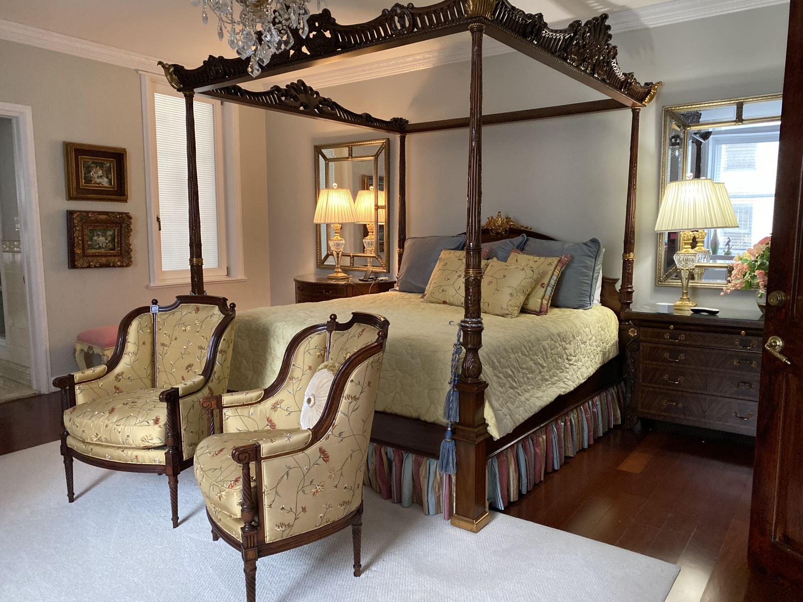 The amazing master bedroom with this exquisite carved and gilt decorated mahogany queen poster bed